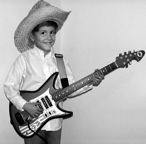 Jordan as a cute kid with a cool guitar!